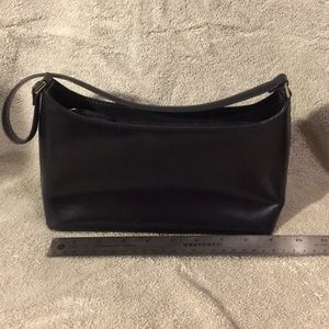 Talbot’s black hard side leather hand bag